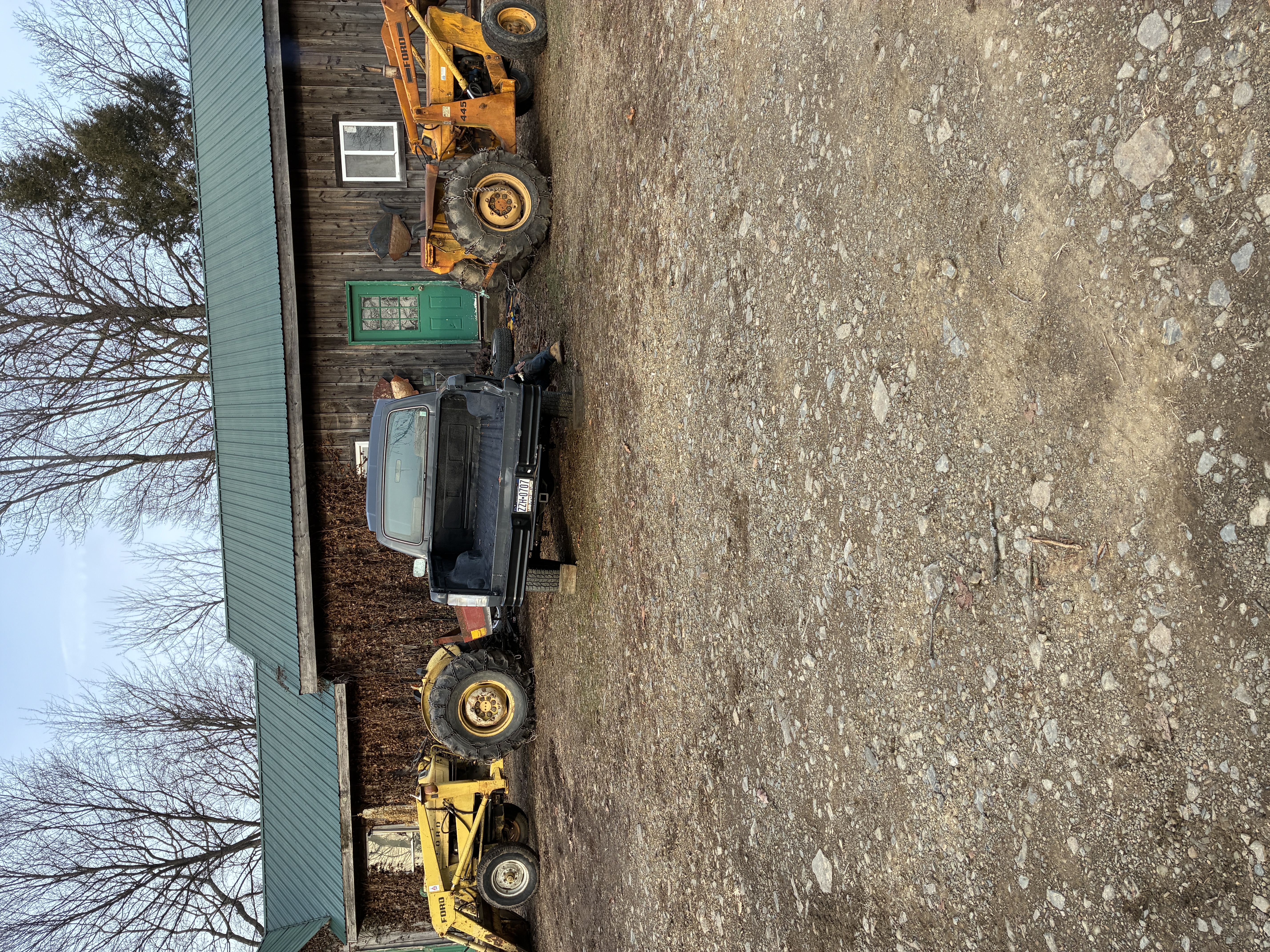 The frame and front axle were bent, so I removed the axle and pulled the frame straight with the tractors