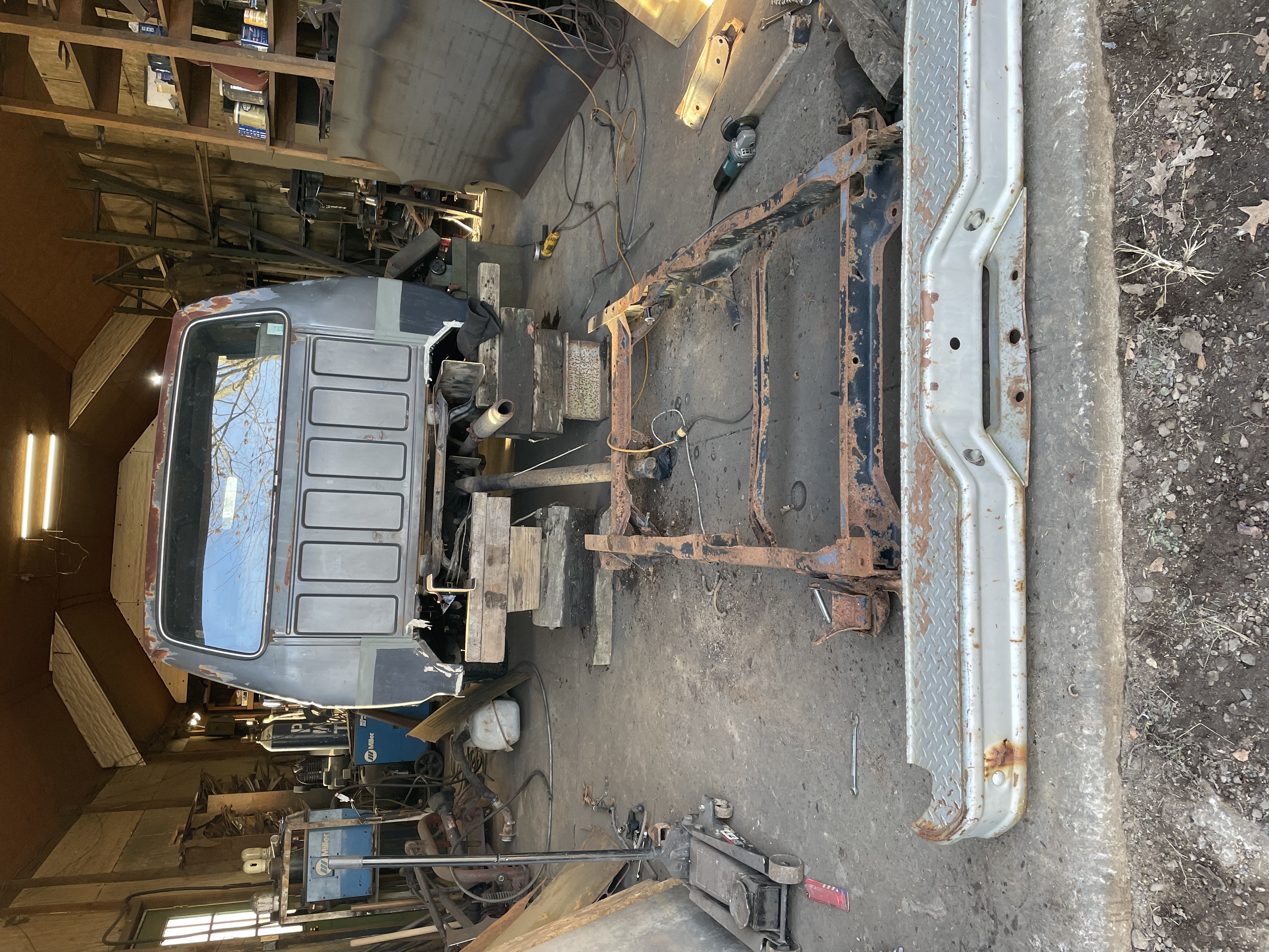 I removed the rear axle and fuel tanks and cut the rear half of the frame off