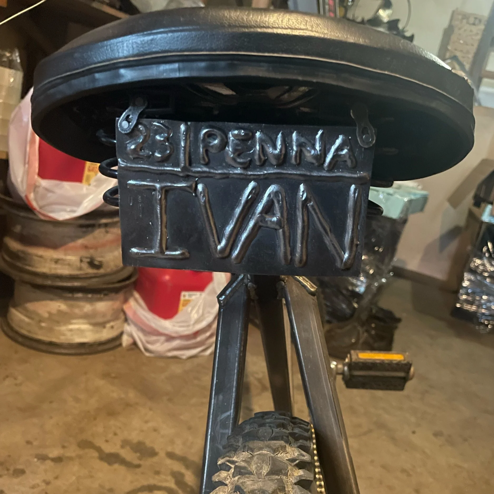 I also welded a custom plate and attached it to the seat with bike chain links